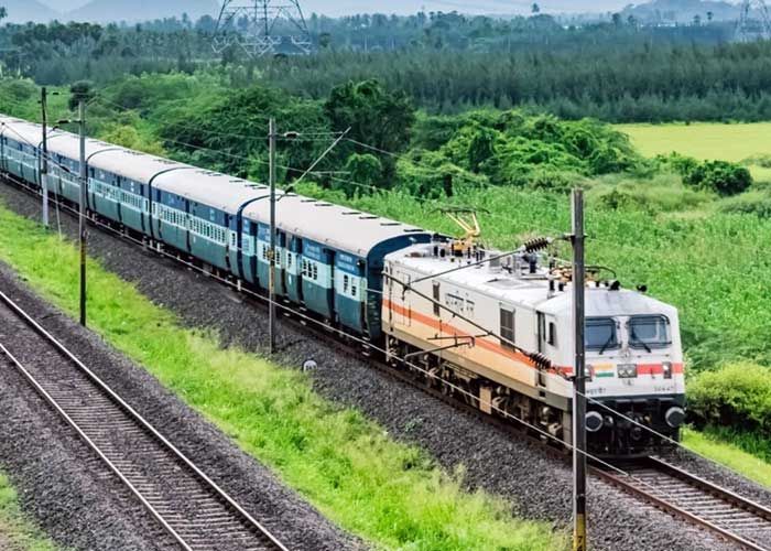 Image of passengers maintaining social distancing while boarding a train. Image of passengers maintaining social distancing while boarding a train.